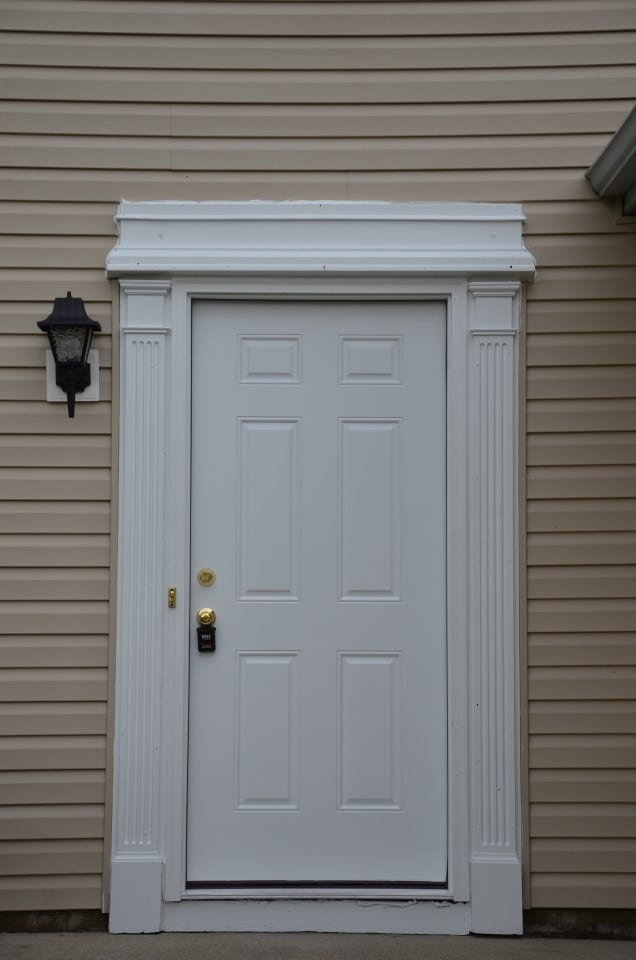 After: a new exterior door with new siding